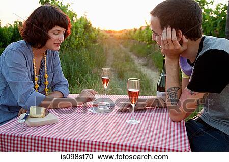 Couple playing cards on table in field View Large Photo Image Stock Image - Couple playing cards on table in field. Fotosearch