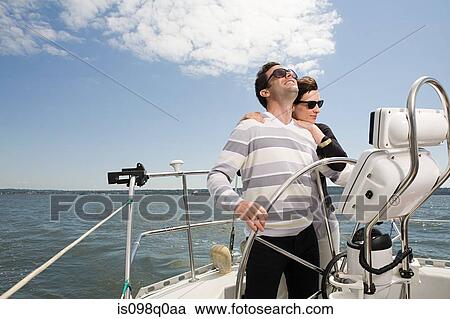 Couple sailing a yacht View Large Photo Image Stock Image - Couple sailing a yacht. Fotosearch