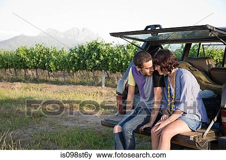 Couple sitting in back of suv View Large Photo Image Stock Photo - Couple sitting in back of suv. Fotosearch