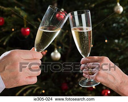 Picture - Couple toasting with champagne. Fotosearch