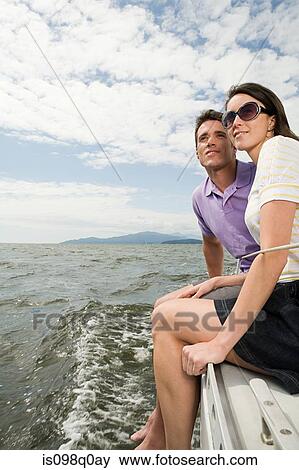 Couple traveling on a sailing boat View Large Photo Image Stock Photo - Couple traveling on a sailing boat. Fotosearch