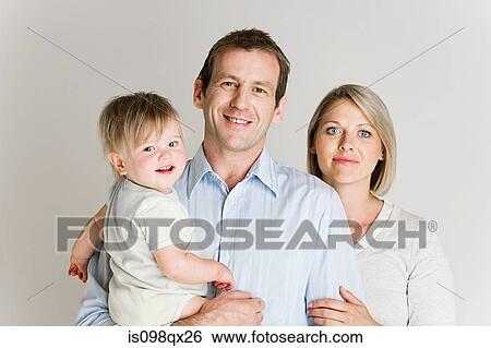Stock Photograph - Couple with baby. Fotosearch