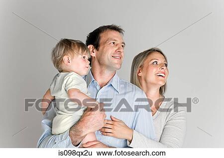 Stock Photograph - Couple with baby. Fotosearch