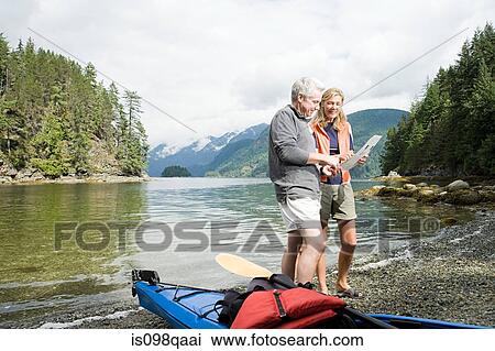 Couple with kayak View Large Photo Image Stock Image - Couple with kayak. Fotosearch