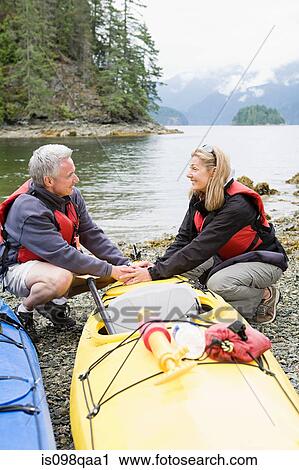 Couple with kayaks View Large Photo Image Stock Image - Couple with kayaks. Fotosearch