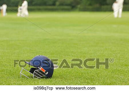 Cricket helmet on a cricket ground View Large Photo Image Stock Photography - Cricket helmet on a cricket ground. Fotosearch