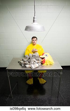 Criminal in chicken suit with money View Large Photo Image Stock Photography - Criminal in chicken suit with money. Fotosearch