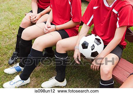 Stock Image - Cropped shot of girl soccer players. Fotosearch