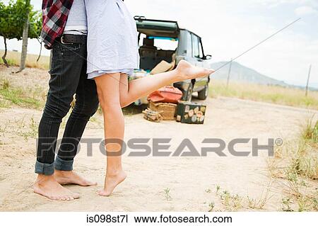 Stock Image - Cropped view of couple. Fotosearch