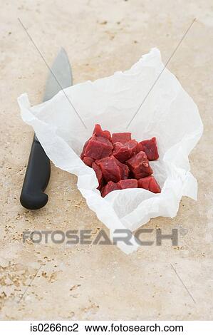 Cubed raw steak and a knife View Large Photo Image Stock Image - Cubed raw steak and a knife. Fotosearch