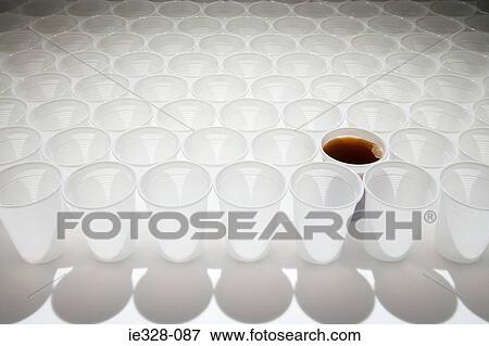 Stock Photo - Cup of cola amongst empty cups. Fotosearch