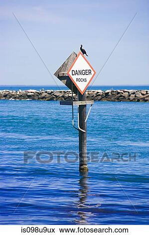 Danger rocks sign in the sea, Montauk, Long Island View Large Photo Image Stock Photo - Danger rocks sign in the sea, Montauk, Long Island. Fotosearch