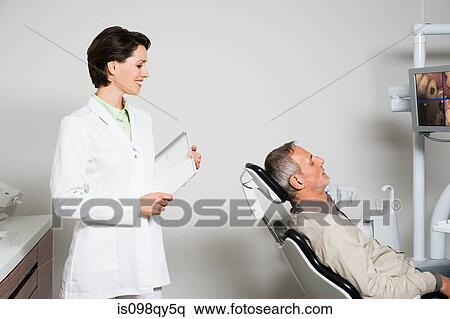 Stock Photography - Dentist and patient. Fotosearch