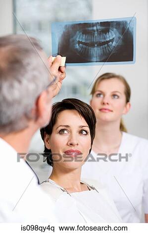 Dentist with patients x-ray View Large Photo Image Stock Photography - Dentist with patients x-ray. Fotosearch