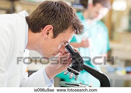 Doctor using microscope View Large Photo Image Stock Image - Doctor using microscope. Fotosearch