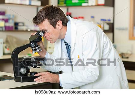 Doctor using microscope View Large Photo Image Stock Photo - Doctor using microscope. Fotosearch