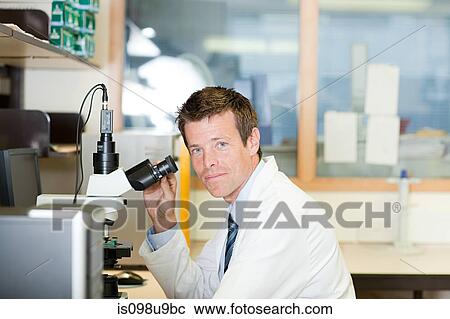 Doctor with microscope View Large Photo Image Stock Image - Doctor with microscope. Fotosearch