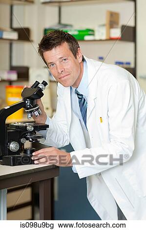 Doctor with microscope View Large Photo Image Stock Image - Doctor with microscope. Fotosearch
