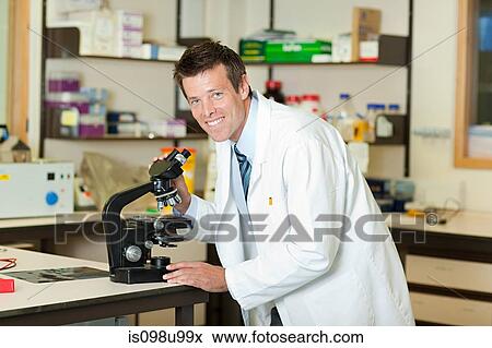 Doctor with microscope View Large Photo Image Stock Photo - Doctor with microscope. Fotosearch