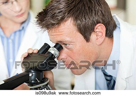 Doctors with microscope View Large Photo Image Stock Image - Doctors with microscope. Fotosearch