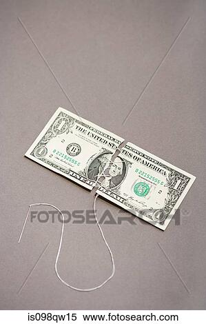 Dollar bill being sewn View Large Photo Image Stock Photography - Dollar bill being sewn. Fotosearch