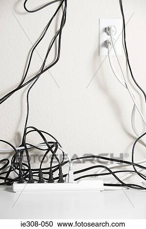 Stock Image - Electrical plugs in a extension cord. Fotosearch