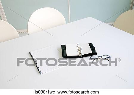 Eyeglasses and diary on a table View Large Photo Image Stock Image - Eyeglasses and diary on a table. Fotosearch