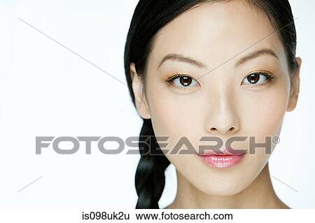 Face of a young chinese woman View Large Photo Image Stock Photograph - Face of a young chinese woman. Fotosearch
