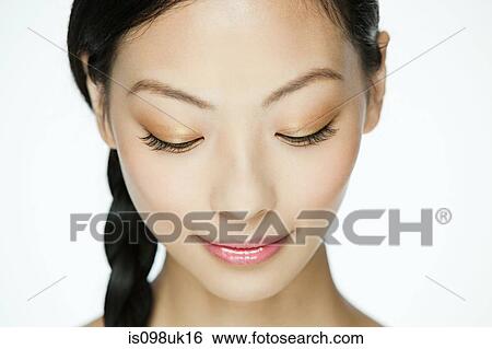Face of a young woman View Large Photo Image Stock Photograph - Face of a young woman. Fotosearch