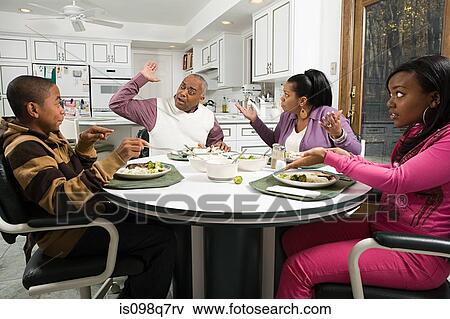 Stock Photo - Family argument at the dinner table. Fotosearch