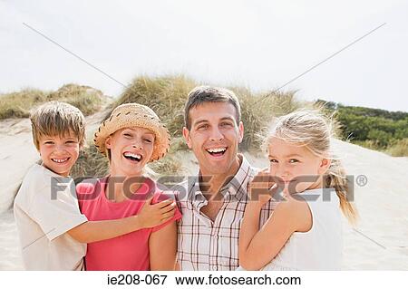 Stock Photo - Family at beach. Fotosearch