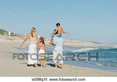 Stock Image - Family at the beach. Fotosearch