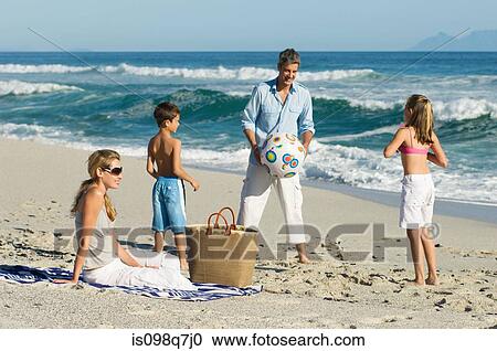 Stock Image - Family at the beach. Fotosearch