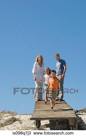 Stock Image - Family at the coast. Fotosearch