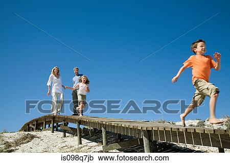 Stock Image - Family at the coast. Fotosearch