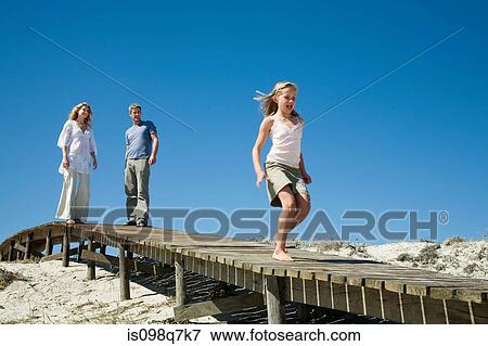 Stock Photo - Family at the coast. Fotosearch