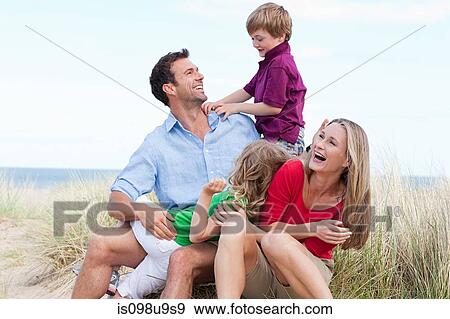 Family having fun at the coast View Large Photo Image Stock Photo - Family having fun at the coast. Fotosearch