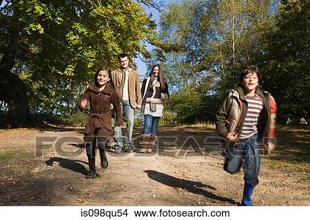 Family having fun in park View Large Photo Image Picture - Family having fun in park. Fotosearch