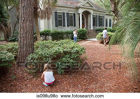 Family playing hide and seek in garden View Large Photo Image Picture - Family playing hide and seek in garden. Fotosearch
