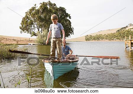 Family with rowing boat View Large Photo Image Picture - Family with rowing boat. Fotosearch