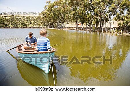 Family with rowing boat View Large Photo Image Stock Photo - Family with rowing boat. Fotosearch