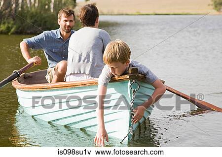 Stock Photo - Family with rowing boat. Fotosearch