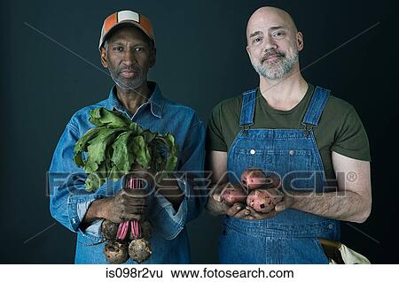 Farmers with vegetables View Large Photo Image Stock Photograph - Farmers with vegetables. Fotosearch