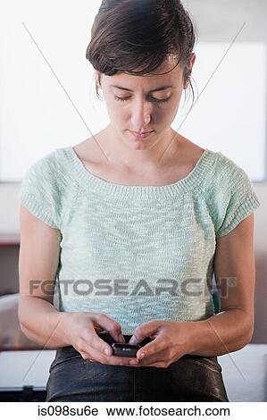Stock Image - Fashion designer at work. Fotosearch