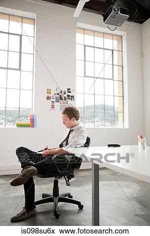 Stock Photo - Fashion designer at work. Fotosearch
