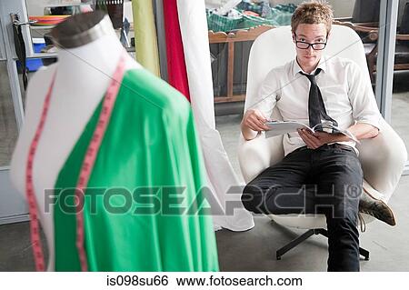 Stock Photograph - Fashion designer at work. Fotosearch