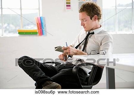Stock Photography - Fashion designer at work. Fotosearch
