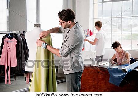 Fashion designers at work View Large Photo Image Picture - Fashion designers at work. Fotosearch