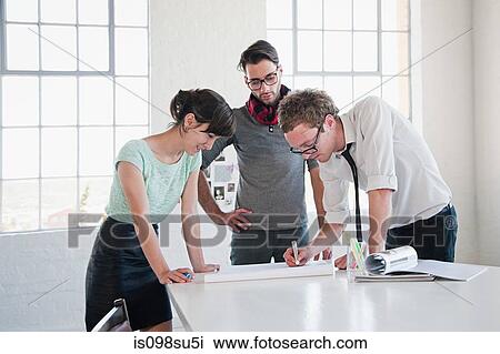 Fashion designers at work View Large Photo Image Stock Image - Fashion designers at work. Fotosearch