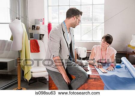 Fashion designers at work View Large Photo Image Stock Image - Fashion designers at work. Fotosearch
